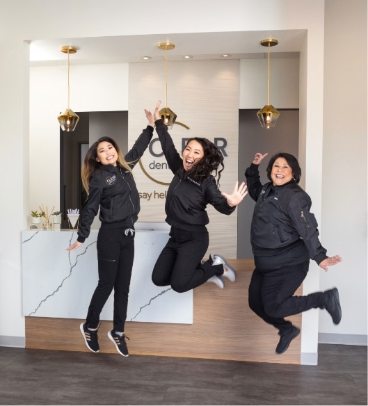 Clear Dental Studio Team Jumping in the Air Happily | Clear Dental Studio Case Study